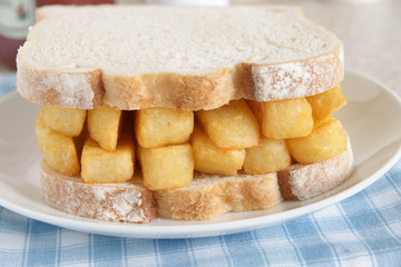 Chip butty potato chips or french fries in a sandwich