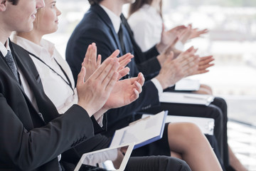 Business people clapping hands