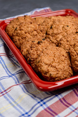 Sweet oatmeal cookies in red tray 
