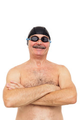 Elderly man is preparing to swim. On his head wearing a special cap and glasses