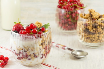 Granola parfait with berry fruit and cream.