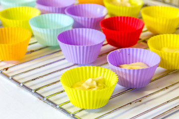 colorful forms for muffins ready for cooking