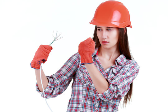 Portrait of young female builder in helmet with cabel on white