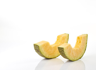 Hamigua Melon cut into slices, Hami Melon, Hami Cantaloupe isolated on white background. stack imag