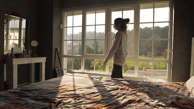 Depressed woman at home in bedroom