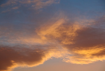 abstract background of defocused blurred flame clouds in the sky