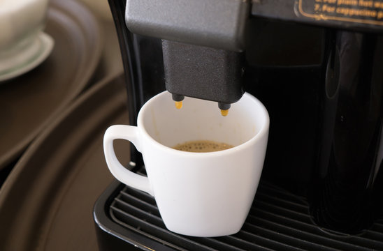 coffee machine makes a hot coffee with icecream