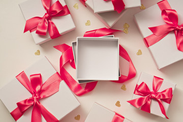 gifts.  white boxes with pink ribbon
