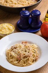 spaghetti carbonara on wooden table