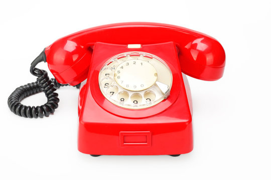 Red vintage phone on a white background