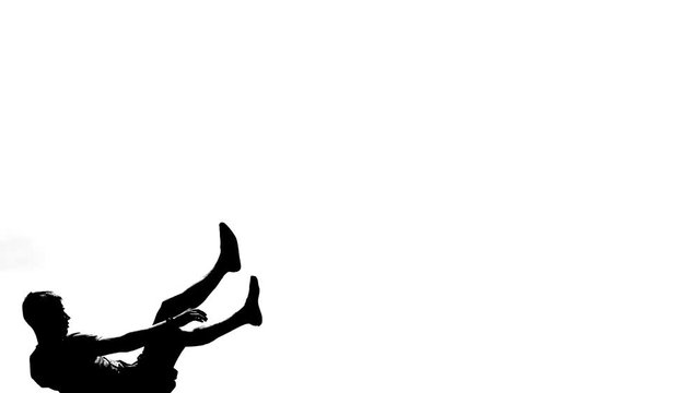 Silhouette of trampoline jumper.
