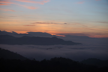 Fog mountain in the early morning sunrise