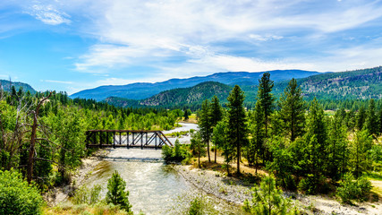 Fototapeta premium Truss Bridge over the Nicola River as it flows along Highway 8 from the town of Merritt to the Fraser River at the town of Spences Bridge in British Columbia, Canada