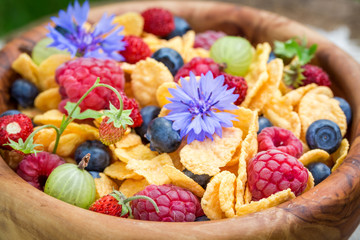 Closeup of healthy flowers and fruits with cornflakes