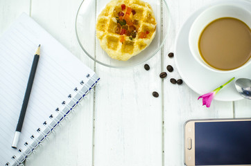 heart shaped waffles and coffee on table