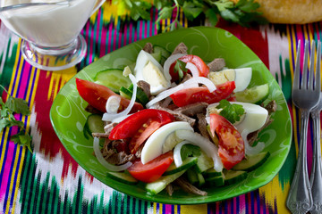 Fresh salad with beef, tomatoes, cucumber and egg - Bakhor. The