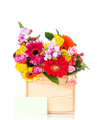 Box of mixed beautiful flowers on white background