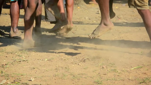 Native men of a remote, Burmese village, stomping a barefoot dance on the dusty ground to celebrate a local festival. Video 1920x1080