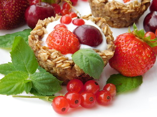 Granola cups for breakfast filled up with yougurt and berries