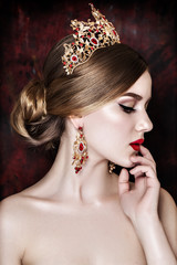 Girl wearing tiara and sparkling jewlery. © redchanka
