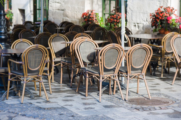 chairs on a cozy summer terrace. Italian cafe with coffee and sweets. exterior restaurant