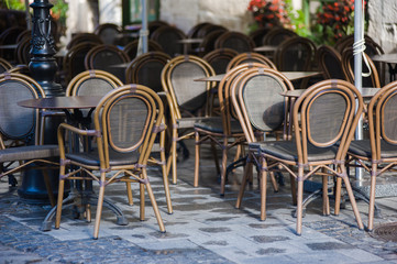 chairs on a cozy summer terrace. Italian cafe with coffee and sweets. exterior restaurant