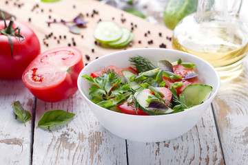 Salad. Tomatoes, cucumbers and onion.