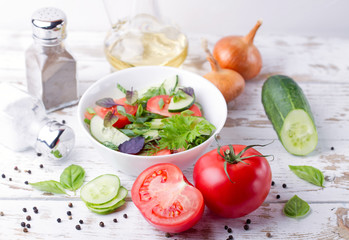 Salad. Tomatoes, cucumbers and onion.