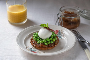 Sandwich with poached egg, bacon on plate  dark background