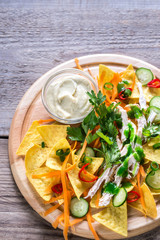 Nachos with chicken and vegetables