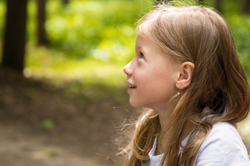 Portrait of beautiful happy little girl summer outdoors