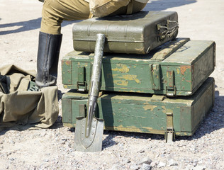 vintage military suitcase, army box of ammunition and sapper shovel