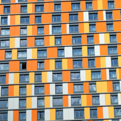 Facade of funny colorful modern residential building close-up