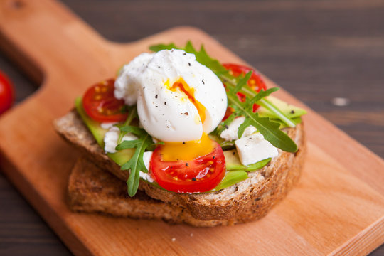 egg on toast with herbs cheese tomatoes