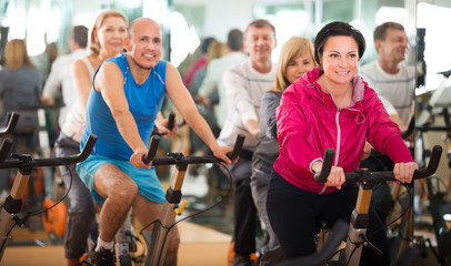 People cycling in a gym