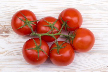 tomatoes on wooden background