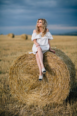 Naklejka na ściany i meble blonde in the hay