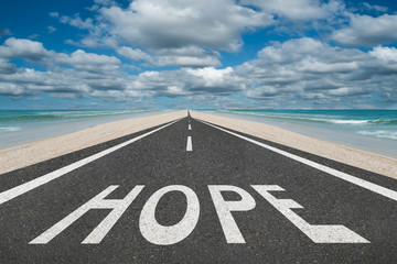 Hope text on highway inspirational concept
