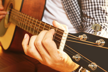 Fototapeta na wymiar Man playing acoustic guitar