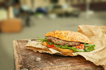 Street food burger on city background