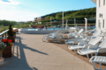 Plastic chaise lounges in luxury hotel