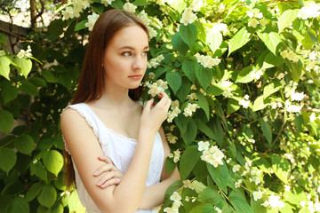 Portrait of beautiful girl with flowers