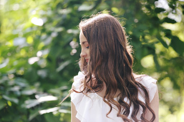 Beautiful girl relaxing in green park