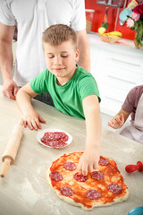 Kids with parents cooking dinner