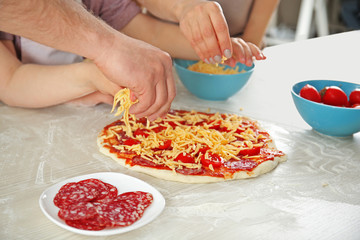 Kids with parents cooking dinner