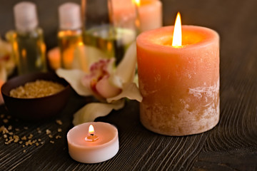 Lighted candles on blurred spa background