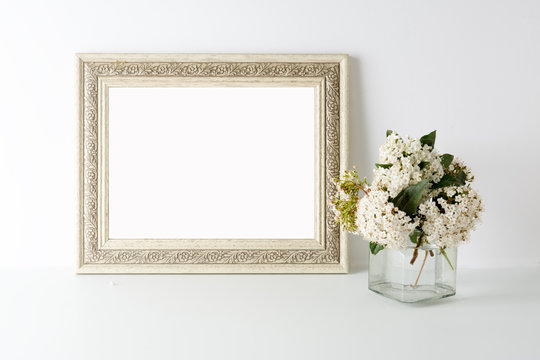 empty picture frame, decorated with white flowers