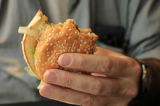 Man holding a hamburger