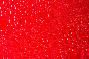 drop of water on red background(selective focus)