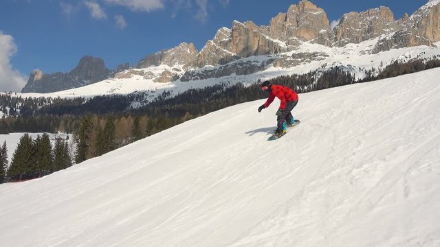 snowboarder doing backflip on kicker traking shot steadicam
